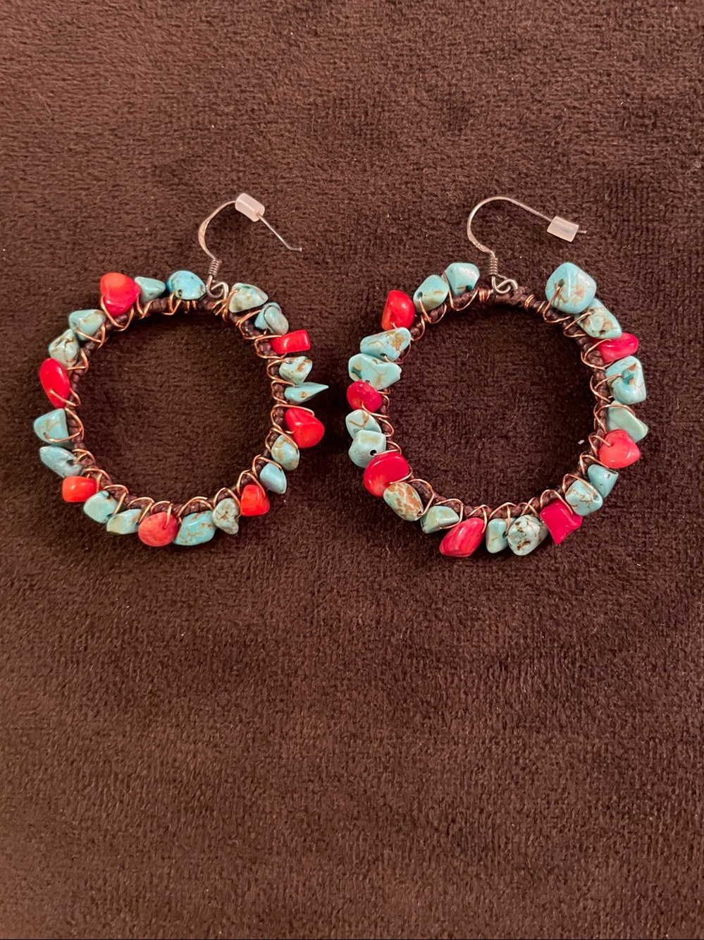 Bohemian-style hoop earrings featuring turquoise and red coral stone chips